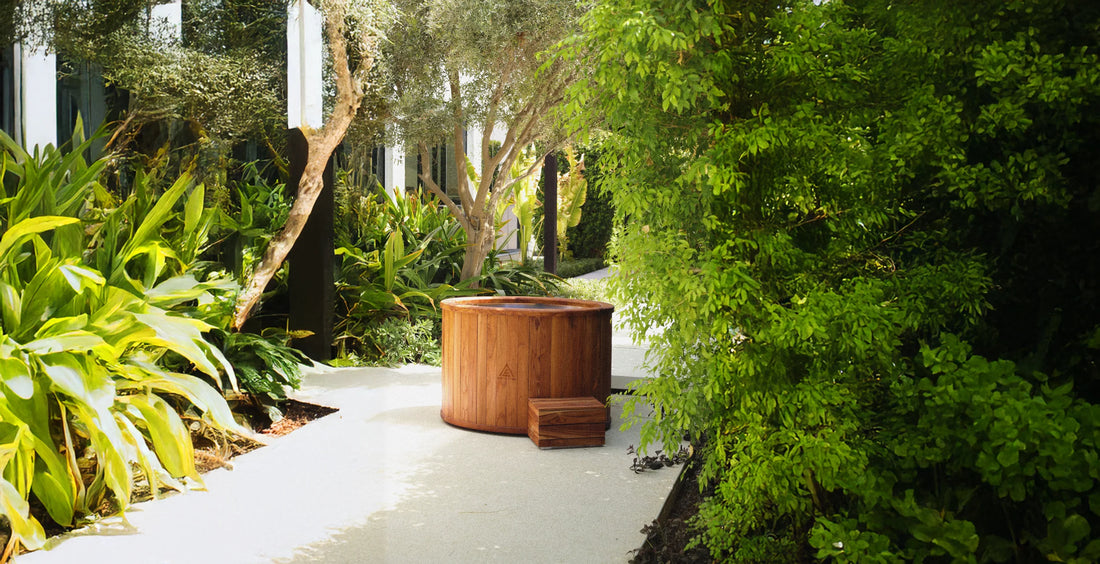 Arctic Edge teak ice bath with matching step in a garden setting